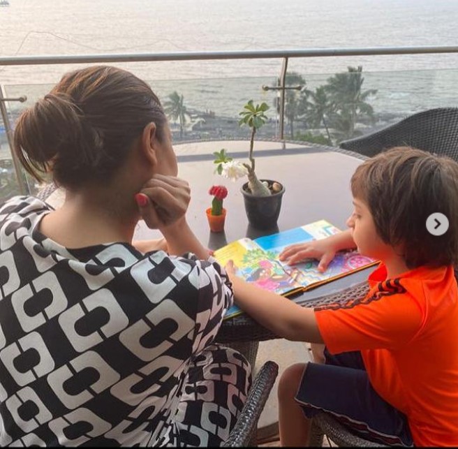 Gauri and Abram reading in their terrace garden overlooking the Arabian sea. (Source: Instagram)